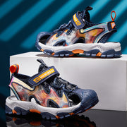 Colorful children's sandals with a brand logo on a reflective surface and blue gradient background