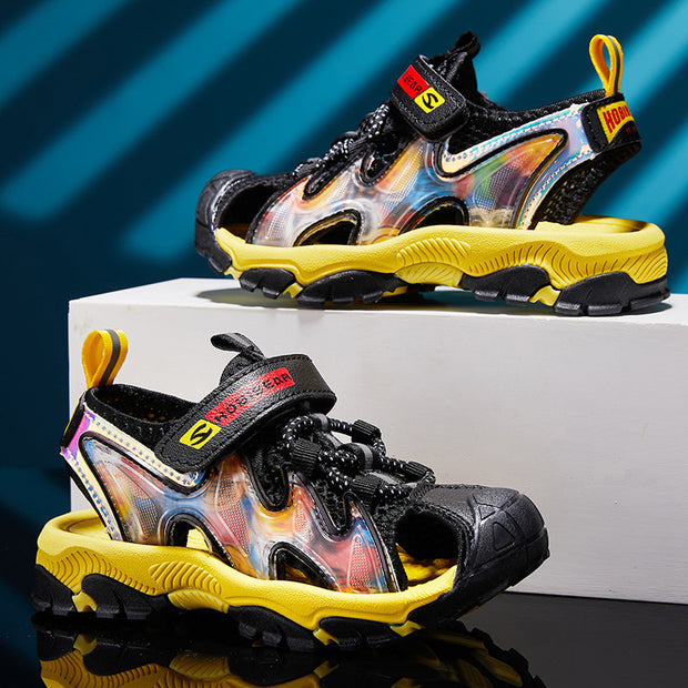 Colorful sandals with black and yellow accents on a reflective surface.