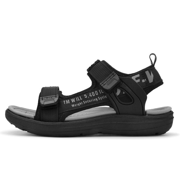 Black sandal with gray sole on a white background